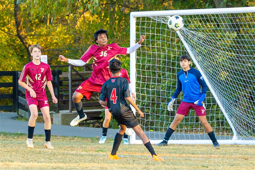 Middle school students play soccer